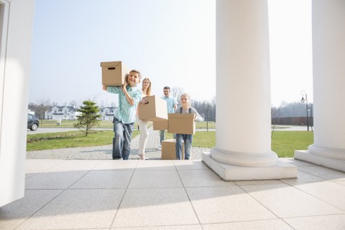 Moving van and packed boxes for house removals in Earlscourt